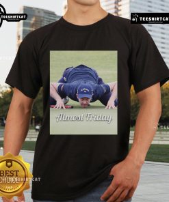 Official Justin Rose Golf Crouch Almost Friday T-Shirt featuring a stylish design for golf enthusiasts.