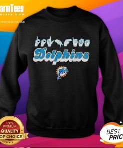 Youth in Miami Dolphins sweatshirt making love sign with hand signals, showcasing team spirit and style.