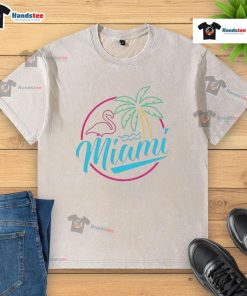 Alt Text: Official Miami Neon Flamingo Logo on a Washed T-Shirt, showcasing vibrant colors and a relaxed, stylish design.