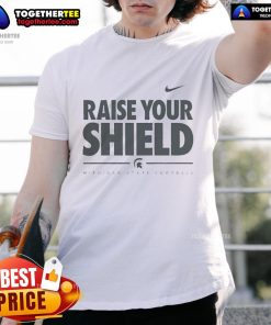 Official Michigan State Spartans Raise Your Shield T-Shirt featuring bold team graphics and vibrant green color.