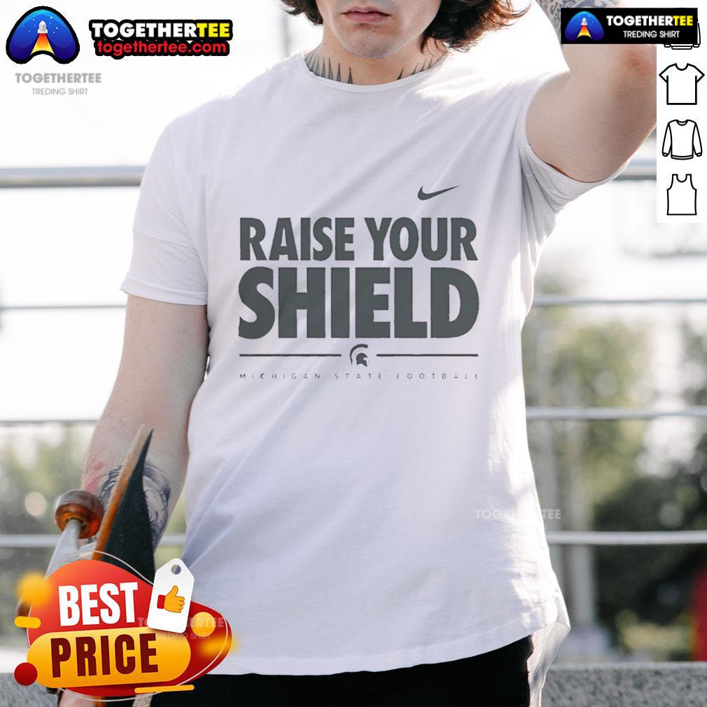 Official Michigan State Spartans Raise Your Shield T Shirt Official Michigan State Spartans Raise Your Shield T-Shirt featuring bold team graphics and vibrant green color.
