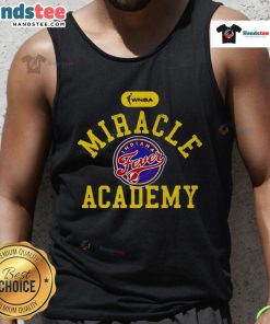 Alt Text: Caitlin Clark wearing an Official Miracle Academy tank top for Indiana Fever, featuring team colors and logo.