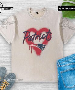 Alt Text: Official New England Patriots Football Spray Heart Washed T-Shirt featuring team colors and logo for fans.