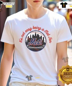 Alt Text: Official New York Mets It's Not Easy Being A Mets Fan MLB T-shirt showcasing team spirit and fan pride.
