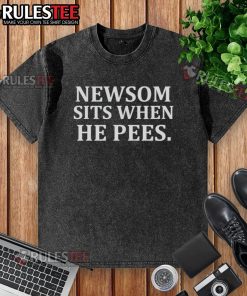 Official Newsom sits while peeing in a washed t-shirt, showcasing a humorous take on casual attire and personal moments.