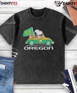 Alt Text: Official Oregon Ducks x Snoopy t-shirt featuring Snoopy and Woodstock driving a car, perfect for fans.