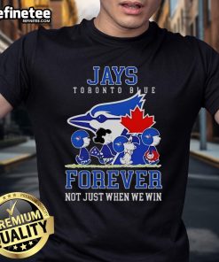 Alt Text: Official Peanuts Charlie Brown Snoopy Toronto Blue Jays Baseball Forever T-Shirt featuring playful design.