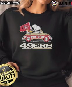 Alt Text: Official San Francisco 49ers x Snoopy sweatshirt featuring Woodstock driving a car in team colors.