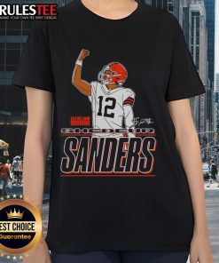 Alt Text: Shedeur Sanders Cleveland Browns Believe signature ladies tee featuring a raised fist design for fans.
