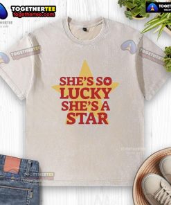 Alt Text: Vintage washed t-shirt featuring She's So Lucky, She's A Star design, perfect for casual fashion lovers.