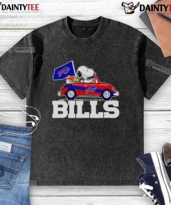 Alt Text: Official Snoopy and Woodstock driving a car on Buffalo Bills washed t-shirt, perfect for fans and collectors.