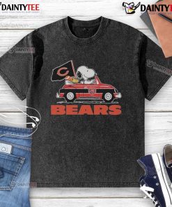 Alt Text: Official Snoopy and Woodstock driving a car on a Chicago Bears washed t-shirt, perfect for fans and collectors.