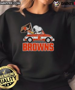 Alt Text: Official Snoopy and Woodstock driving car on Cleveland Browns sweatshirt, perfect for fans and cozy wear.