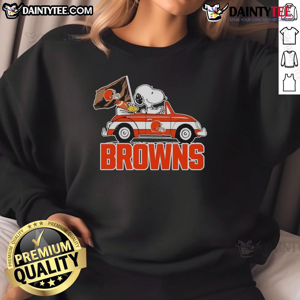 Official Snoopy And Woodstock Driving Car Cleveland Browns Sweatshirt Alt Text: Official Snoopy and Woodstock driving car on Cleveland Browns sweatshirt, perfect for fans and cozy wear.