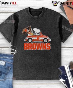 Alt Text: Official Snoopy and Woodstock driving a car on a Cleveland Browns washed t-shirt, perfect for fans and casual wear.