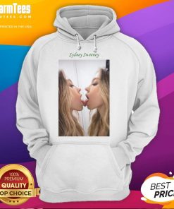 Alt Text: Sydney Sweeney kissing a mirror while wearing a stylish hoodie, showcasing her trendy fashion sense and playful vibe.