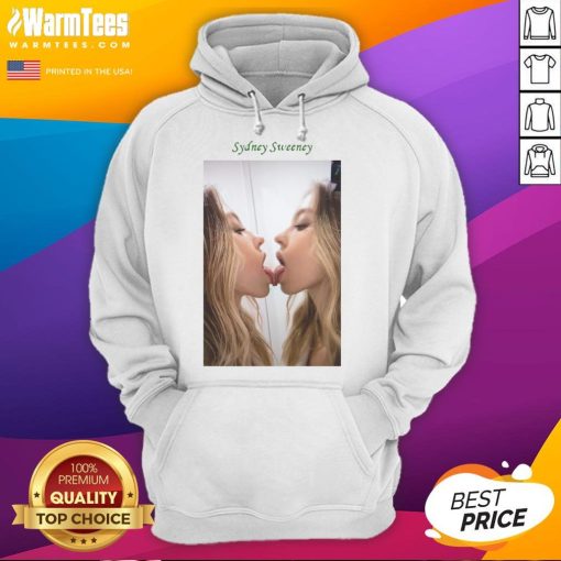 Alt Text: Sydney Sweeney kissing a mirror while wearing a stylish hoodie, showcasing her trendy fashion sense and playful vibe.