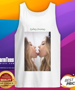 Sydney Sweeney kissing a mirror while wearing a stylish tank top, showcasing her trendy fashion and confident vibe.