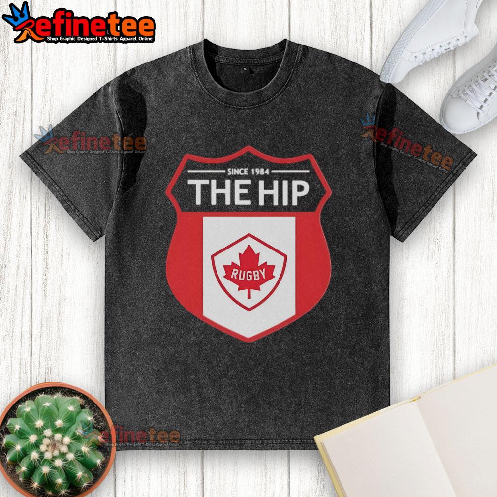 Official The Hip Since 1984 Rugby Washed T Shirt Official The Hip Since 1984 Rugby Washed T-Shirt in vintage style, featuring a classic logo and soft fabric for comfort.
