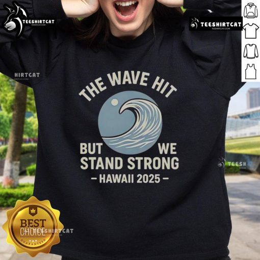 Alt Text: Official The Wave Hit But We Stand Strong Hawaii 2025 Sweatshirt featuring bold graphics and vibrant colors.