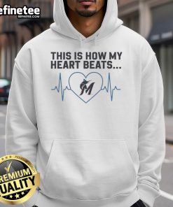 Alt Text: Miami Marlins hoodie featuring This Is How My Heart Beats graphic, perfect for fans showcasing team spirit.