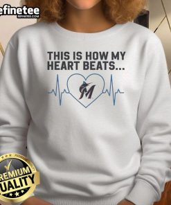 Alt Text: Official Miami Marlins sweatshirt featuring 'This Is How My Heart Beats' design, perfect for fans and casual wear.