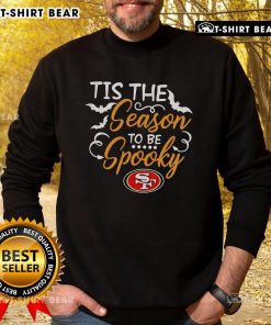 Official Tis The Season To Be Spooky San Francisco 49ers sweatshirt featuring festive design and team logo.