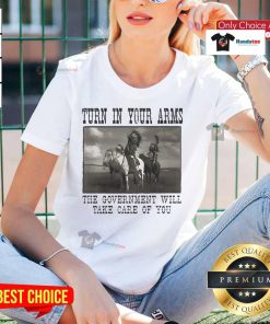 Official Turn In Your Arms Native American Ladies Tee featuring bold graphics promoting government support and care.
