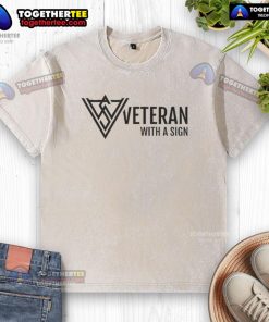 Official veteran with a sign wearing a logo washed t-shirt, showcasing pride and support for veterans.