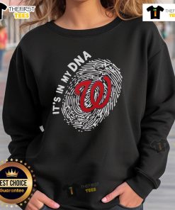Alt Text: Official Washington Nationals In My DNA sweatshirt displayed on a hanger, showcasing team pride and stylish design.