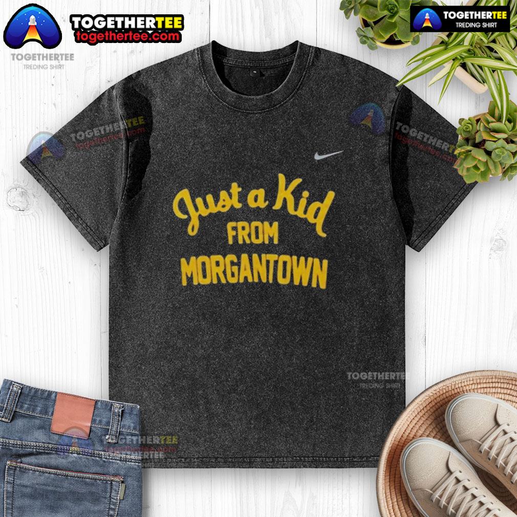 Official West Virginia Mountaineers Just A Kid From Morgantown Washed T Shirt Alt Text: Official West Virginia Mountaineers 'Just A Kid From Morgantown' washed t-shirt displayed on a wooden background.