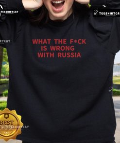Alt Text: Official 'What The F*ck Is Wrong With Russia' sweatshirt featuring bold text design on a stylish black background.