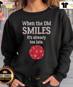 Alt Text: Official When The DM Smiles It's Already Too Late Sweatshirt in black, featuring bold text design on a cozy fabric.