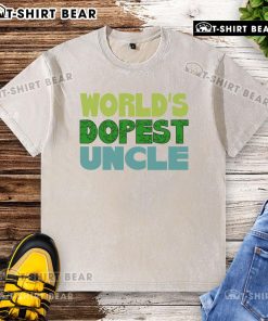 Official Worlds Dopest Uncle washed t-shirt featuring bold graphic design, perfect for casual wear and gifts.