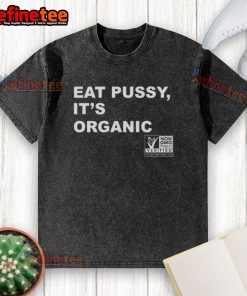 Original Eat Pussy It's Organic Non-GMO Project Verified washed t-shirt displayed on a wooden background.