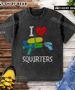 Original I Love Squirters washed t-shirt displayed on a wooden background, showcasing its unique design and soft fabric.