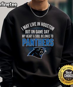 Alt Text: Cozy sweatshirt featuring I May Live in Houston, But My Heart Belongs to Carolina Panthers for passionate fans.