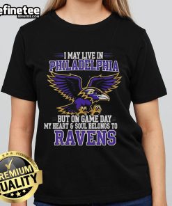 Original I May Live In Philadelphia But My Heart Belongs To Baltimore Ravens Ladies Tee in vibrant purple design.