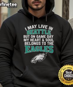 Original hoodie featuring 'I May Live In Seattle But On Gameday My Heart Belongs To Philadelphia Eagles' design.