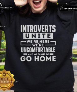 Alt Text: Cozy Introverts Unite sweatshirt design featuring the phrase We're here, we're uncomfortable, and we want to go home.