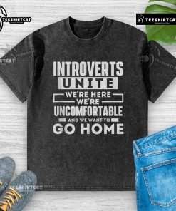 Original Introverts Unite T-shirt featuring the slogan 'We're Here, We're Uncomfortable, and We Want to Go Home' in a stylish design.