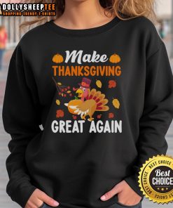 Cozy Thanksgiving sweatshirt featuring 'Make Thanksgiving Great Again' with turkey and pumpkin design.