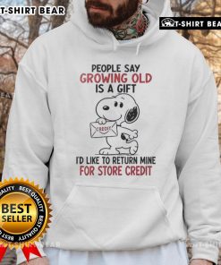Original Snoopy hoodie featuring 'Growing old is a gift, I'd like to return mine for credit' design in vibrant colors.