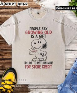 Original Snoopy Growing Old Is A Gift washed t-shirt featuring Snoopy and a humorous quote about aging.