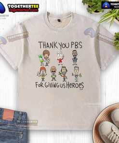 Original Thank You PBS for Giving Us Heroes washed t-shirt displayed on a hanger, showcasing its unique design and colors.