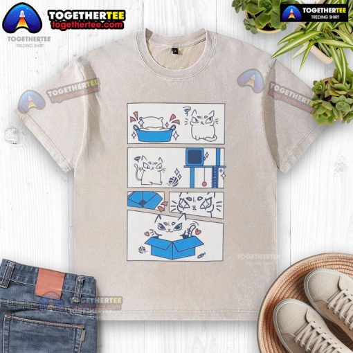 Alt Text: Cute cat sitting in a box wearing the 'Ure Cute' washed T-shirt, showcasing its playful personality and love for boxes.