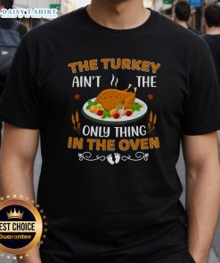 Alt Text: Original The Turkey Ain't The Only Thing In The Oven T-Shirt featuring a humorous Thanksgiving design.