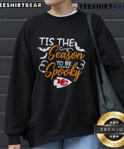 Alt Text: Cozy 'Tis The Season To Be Spooky' Kansas City Chiefs sweatshirt perfect for Halloween celebrations and game day.