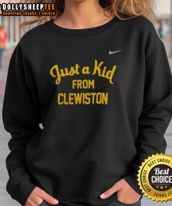 Original West Virginia Mountaineers 'Just a Kid from Clewiston' sweatshirt displayed on a hanger against a neutral background.
