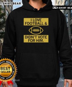Premium I Love Football and Didn't Vote For Him Hoodie displayed on a mannequin in a casual setting, perfect for football fans.
